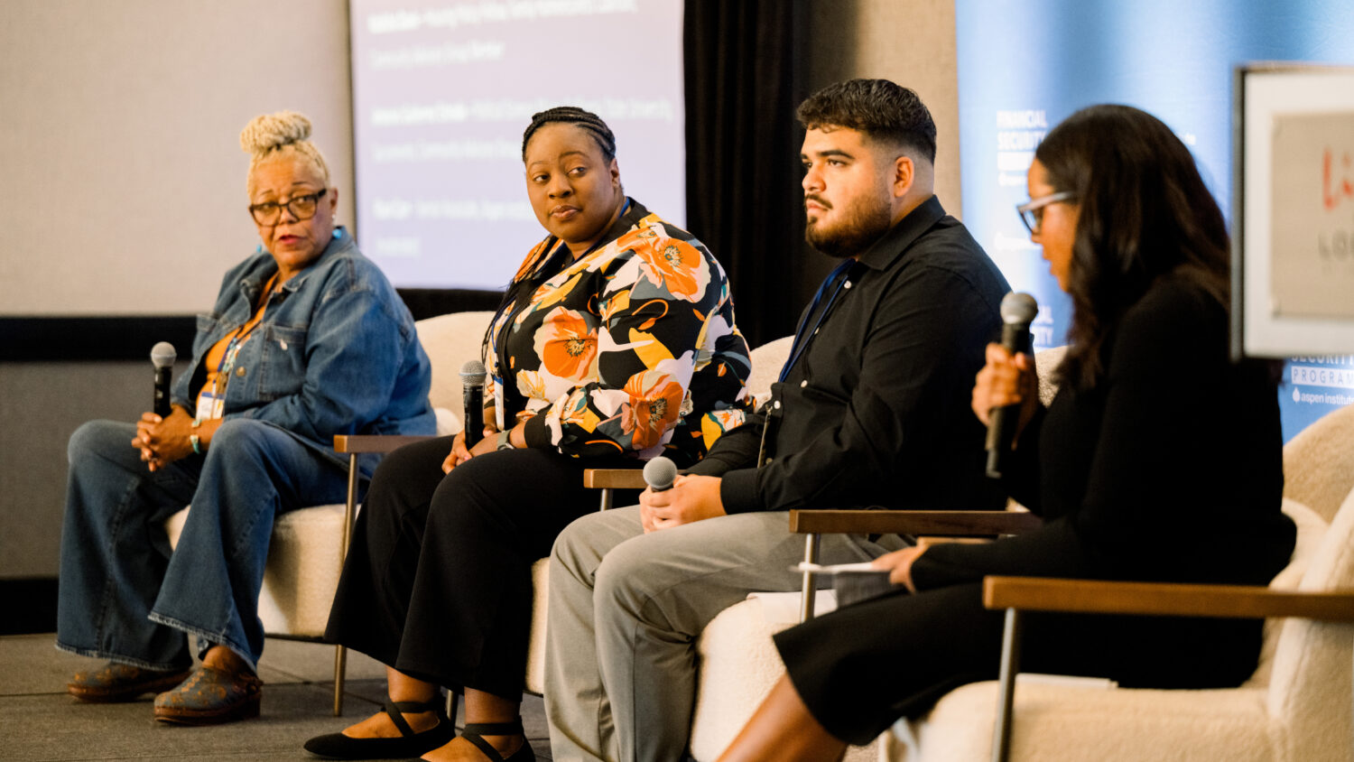 Members of Aspen FSP's Community Advisory Group speak onstage at an event.